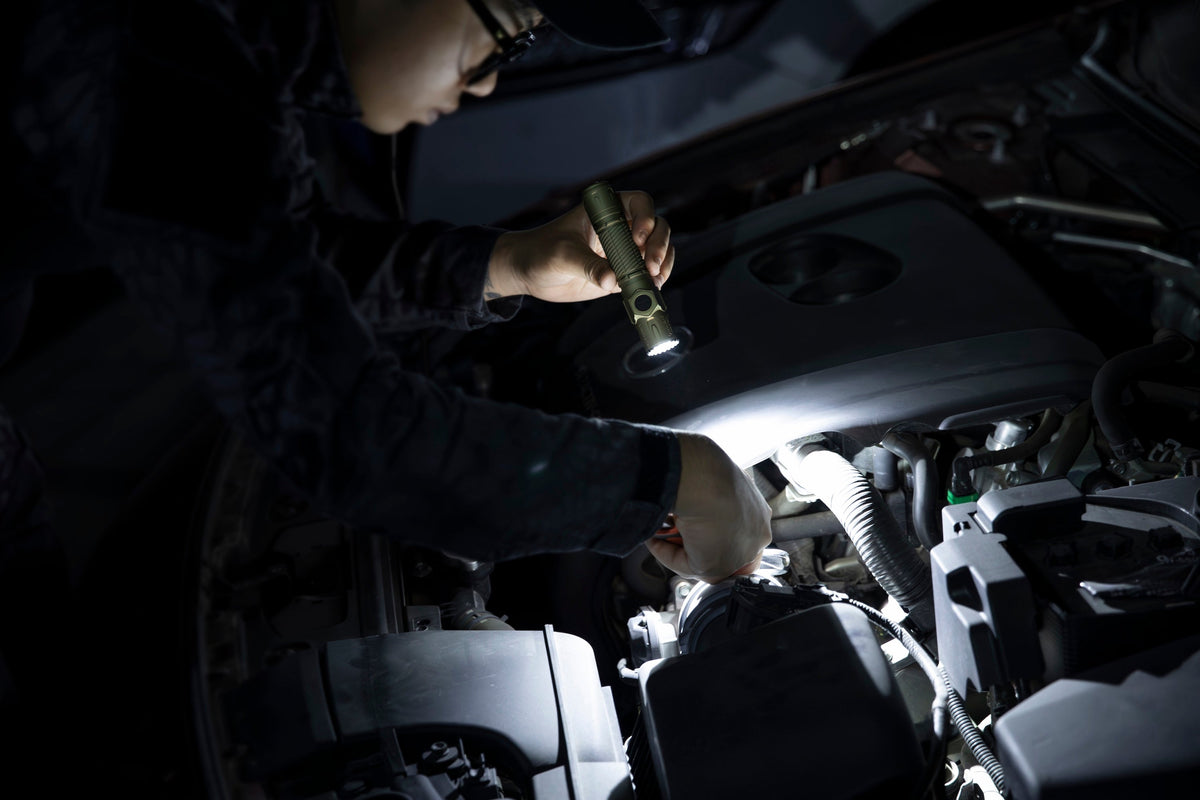Olight Warrior Ultra used for nighttime vehicle inspection