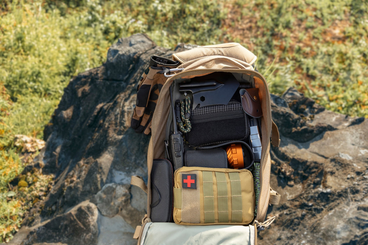 Olight Marauder 3 Orange packed with outdoor and emergency gear