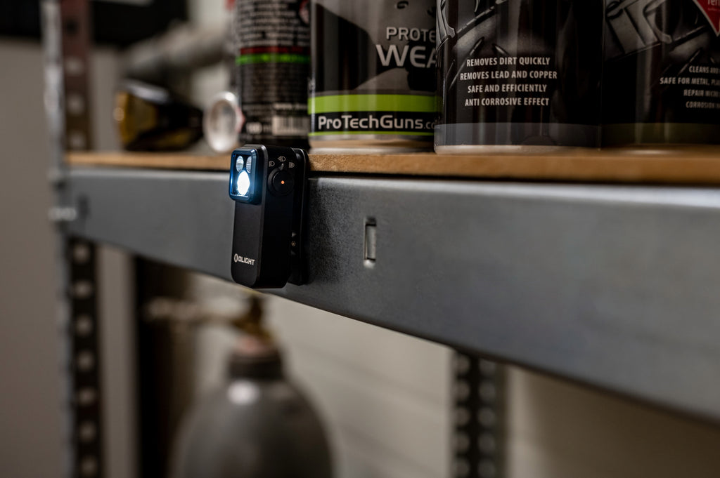 Olight Oclip 2 Pro mounted hands-free on a metal work surface