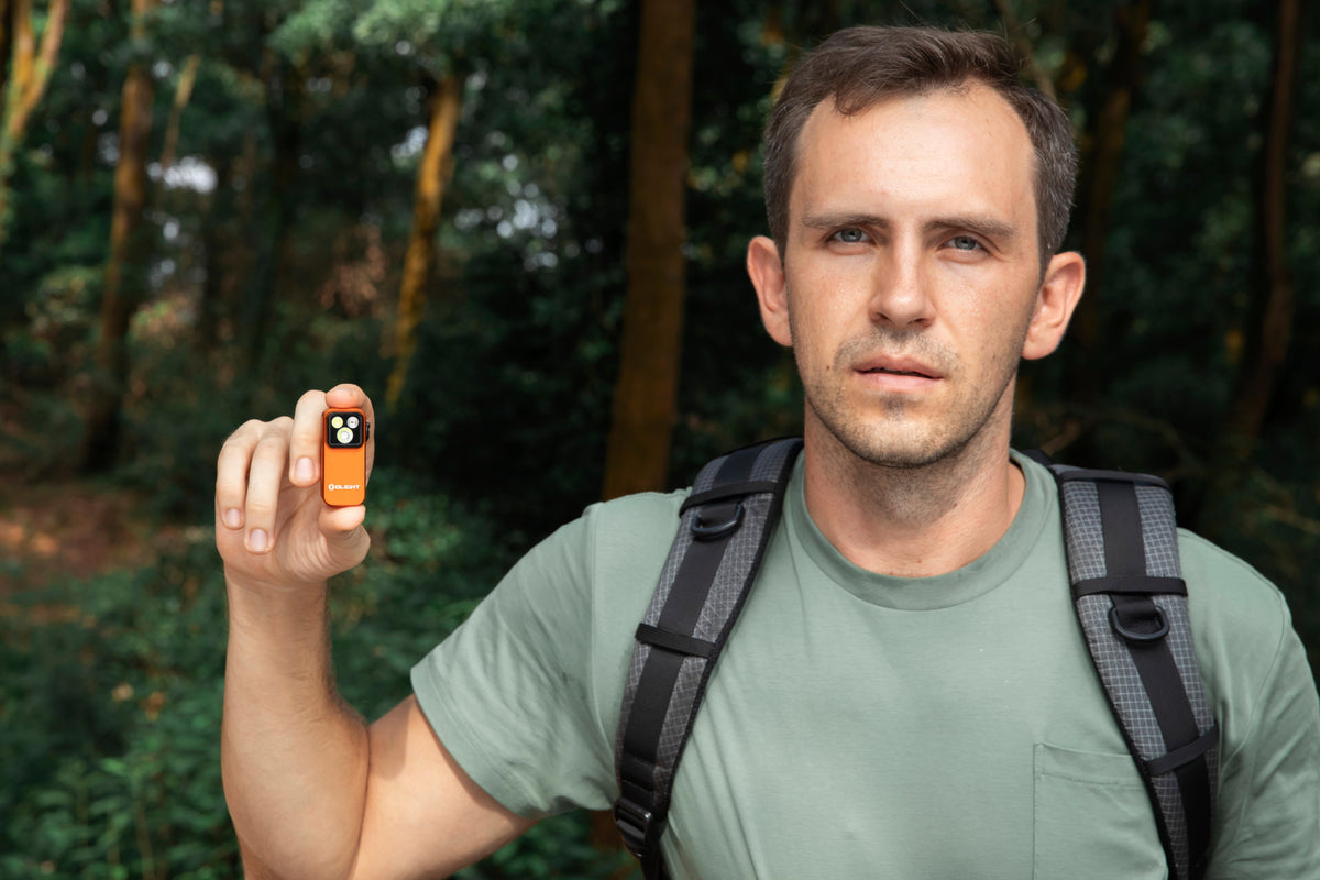 Olight Oclip 2 Pro Orange shown during an outdoor hike