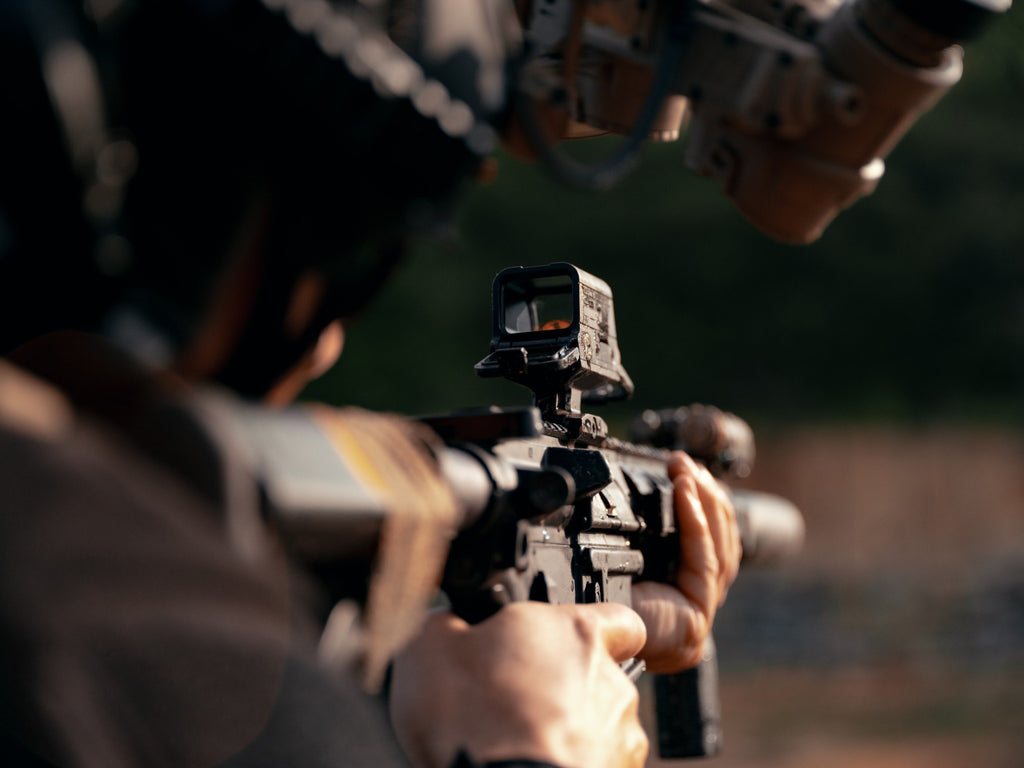 Olight OSIGHT R enclosed red dot sight mounted for outdoor use