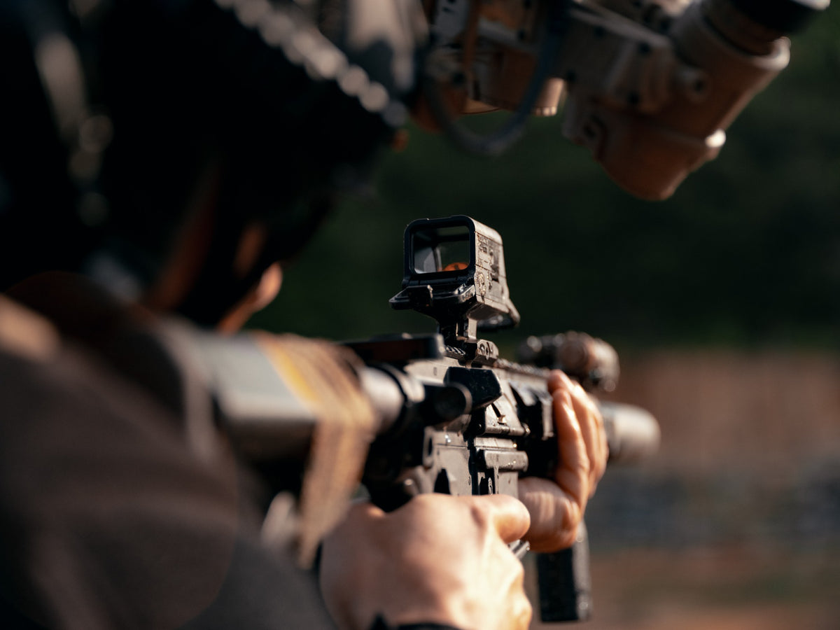 Olight OSIGHT R enclosed red dot sight mounted for outdoor use