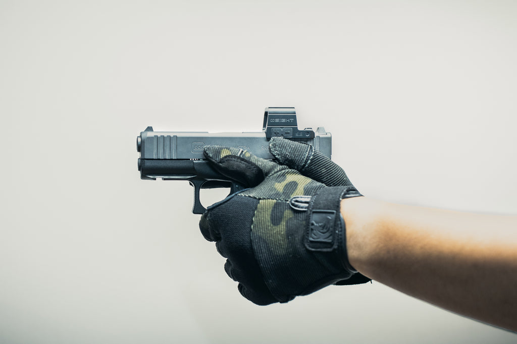 Olight OSIGHT SE mounted on a handgun during use