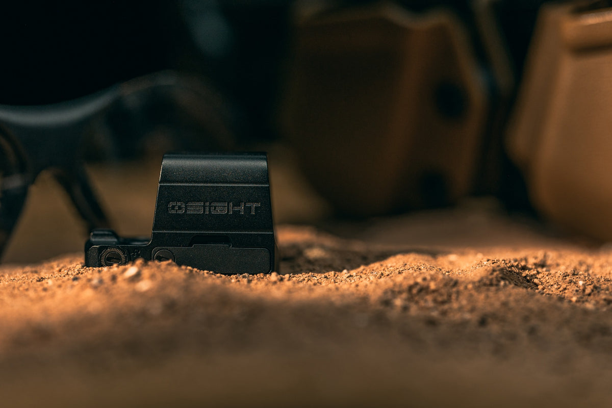 Olight OSIGHT SE optic close-up in sand