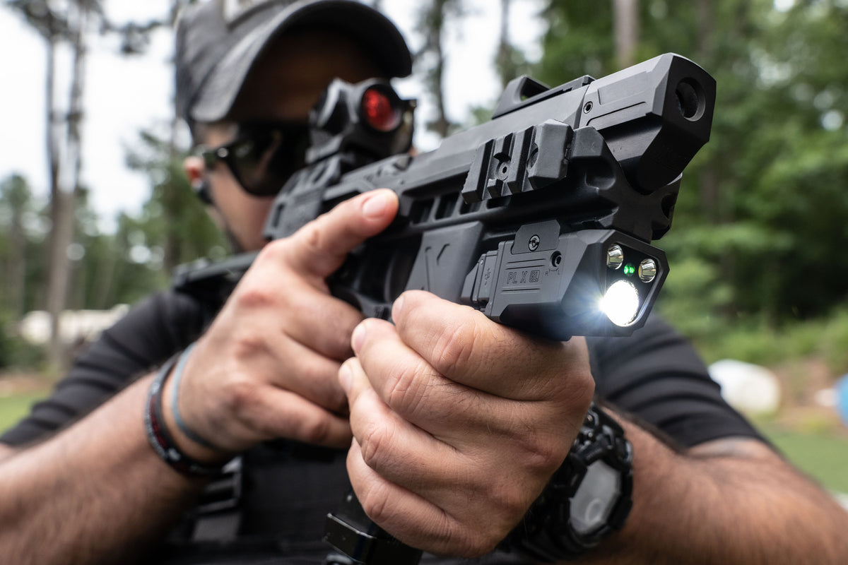 Olight PL X GL mounted light in use at an outdoor range