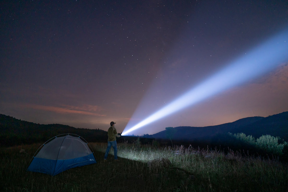 Olight Warrior X 4 long-range beam during nighttime outdoor use